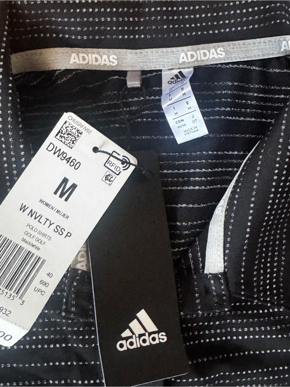 Adidas Woman’s black Striped Golf polo